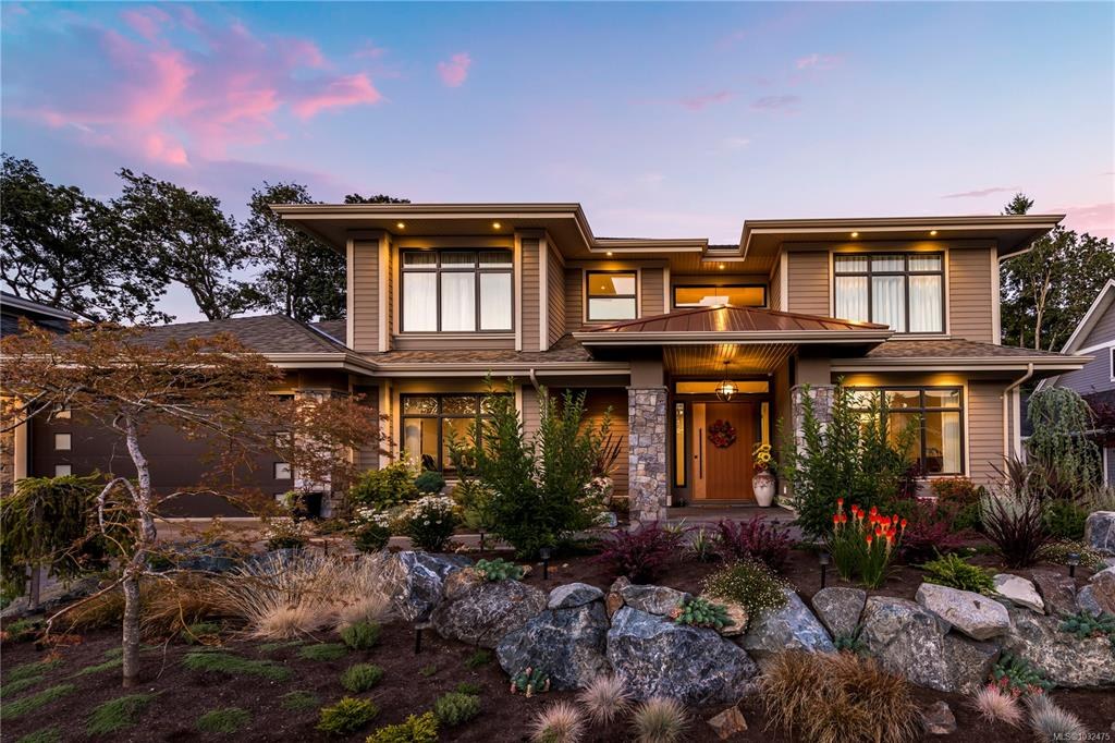 A west coast contemporary home with landscaped garden at twilight