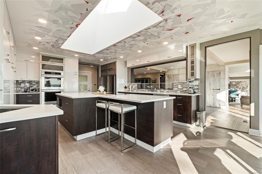 Bright open kitchen with a large island and sunlit wood floors