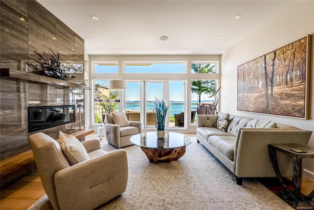 Bright living room with a fireplace and ocean views