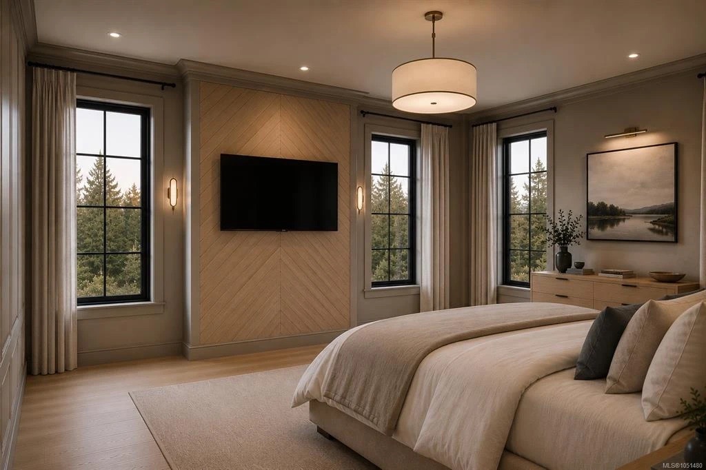 Calm primary bedroom with tall black-framed windows looking out to evergreen trees