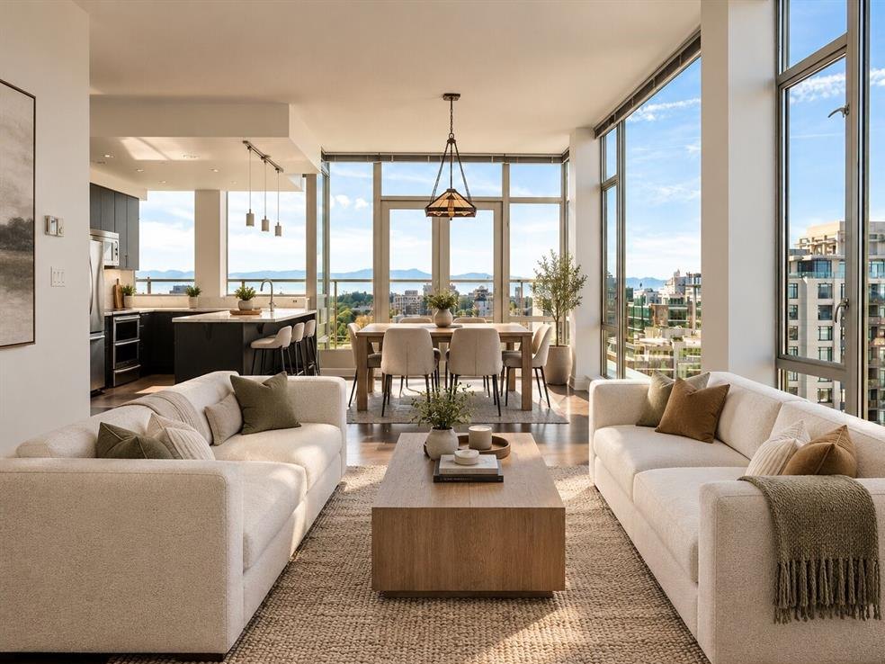 Bright condo living and dining room with city and ocean views