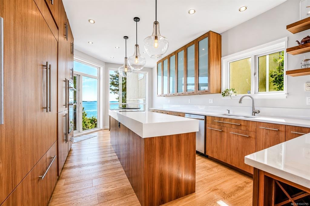 Walnut kitchen with doors open to an ocean view