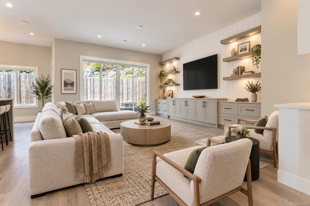Light, newly finished living room with built-in shelving